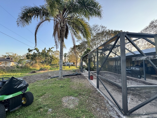 view of yard featuring a lanai