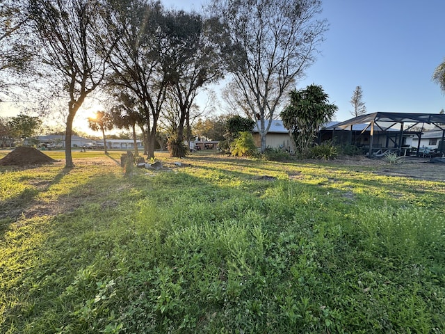 yard at dusk with glass enclosure