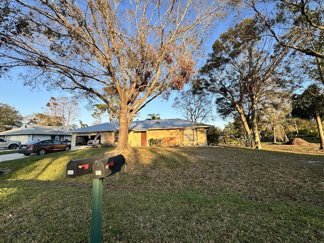 ranch-style house with a front lawn