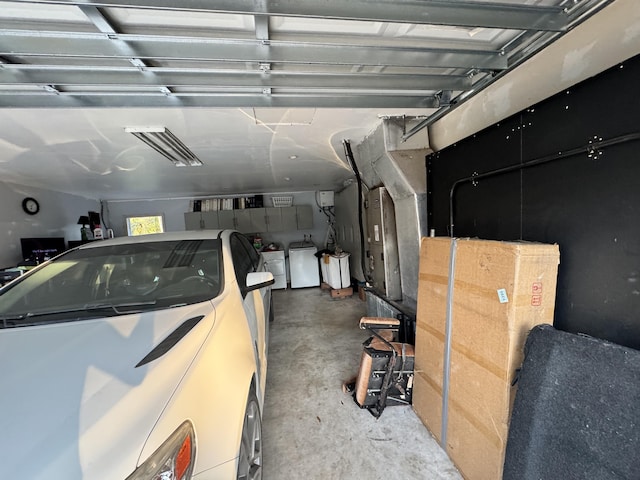 garage featuring washing machine and dryer