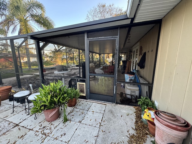 property entrance featuring a patio area