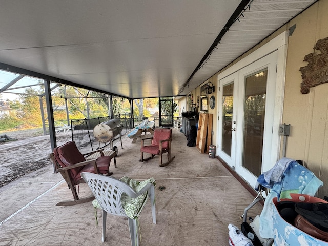 sunroom featuring french doors