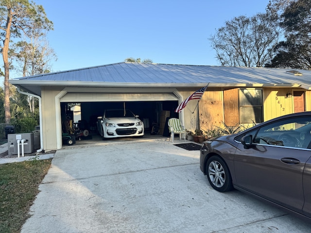 view of side of property with a garage