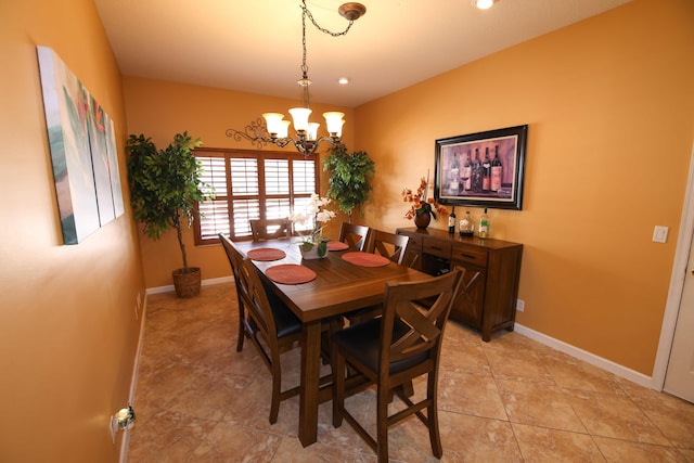 dining room with a notable chandelier