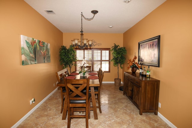 dining area featuring a chandelier