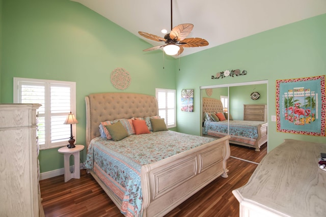 bedroom featuring ceiling fan, dark hardwood / wood-style flooring, and high vaulted ceiling