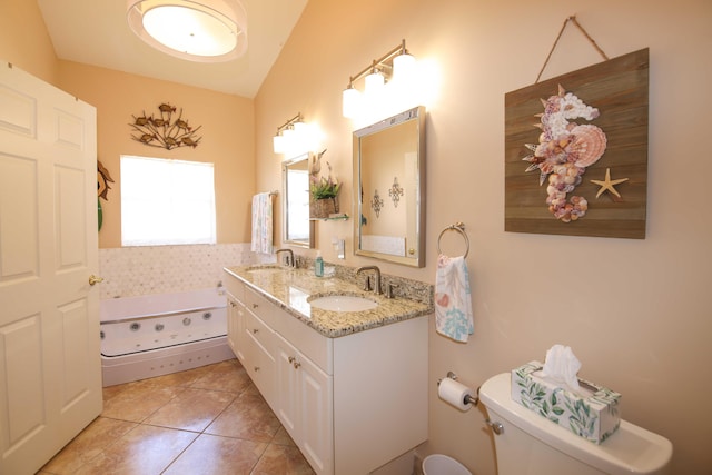 bathroom with toilet, vanity, tile patterned floors, and a bathing tub