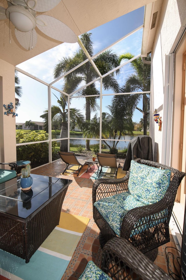 view of patio with a lanai and ceiling fan