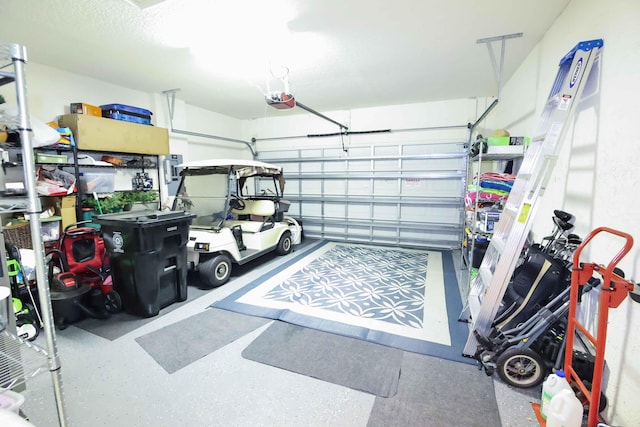 garage featuring a garage door opener