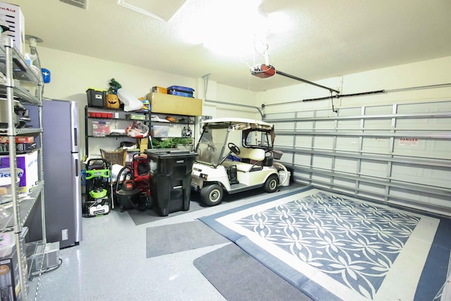 garage featuring a garage door opener