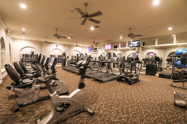 exercise room with carpet and crown molding