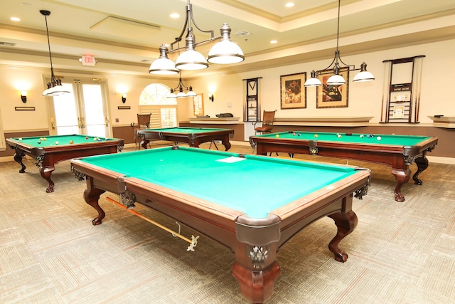 recreation room with pool table, ornamental molding, and a tray ceiling