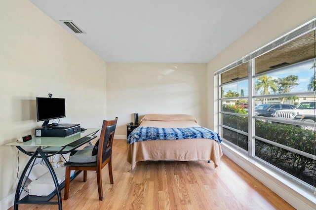 bedroom with hardwood / wood-style floors