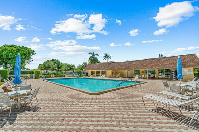 view of pool featuring a patio