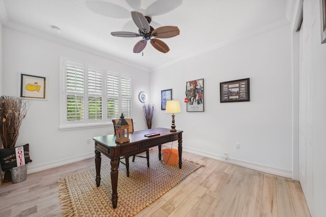 office space with ceiling fan, ornamental molding, and light hardwood / wood-style flooring