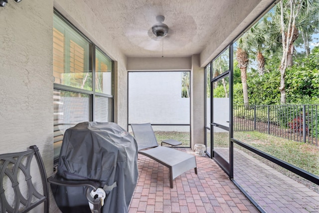 sunroom / solarium with ceiling fan