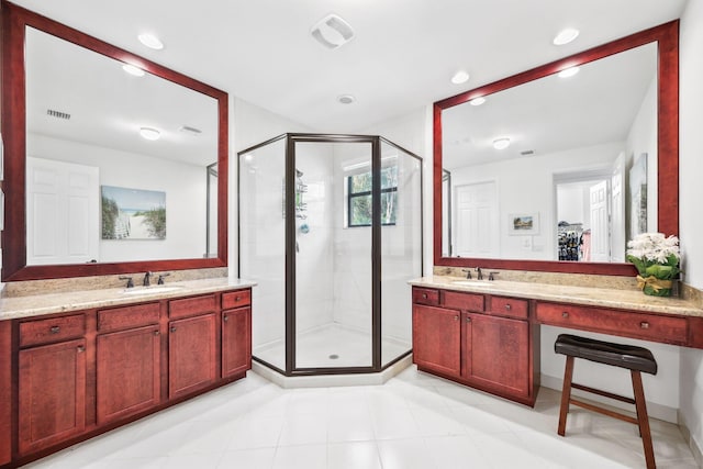 bathroom featuring vanity and a shower with door