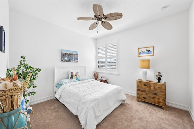 bedroom with light carpet and ceiling fan