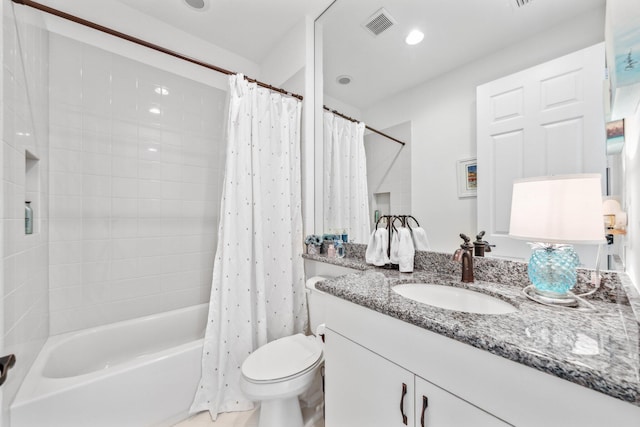 full bathroom featuring toilet, vanity, and shower / bath combo with shower curtain