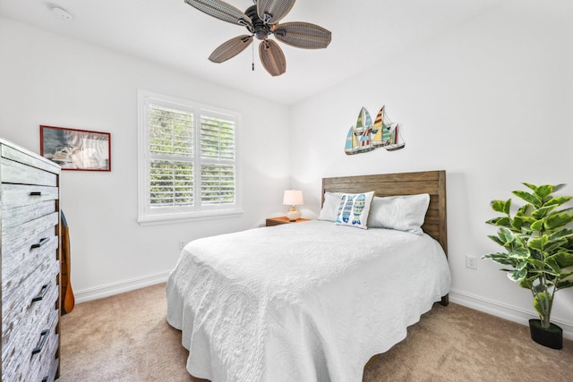 bedroom featuring ceiling fan and light carpet