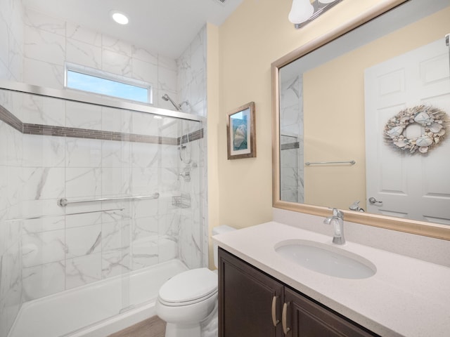 bathroom with vanity, an enclosed shower, and toilet