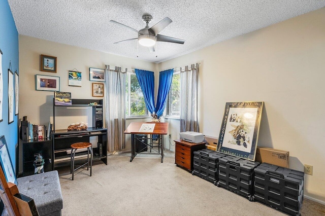 interior space featuring carpet flooring, ceiling fan, and a textured ceiling