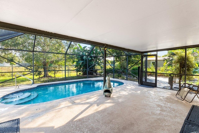 view of pool featuring a lanai and a patio