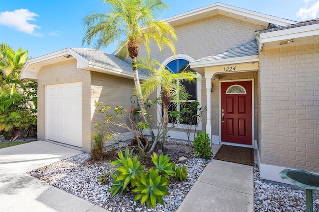 view of exterior entry featuring a garage