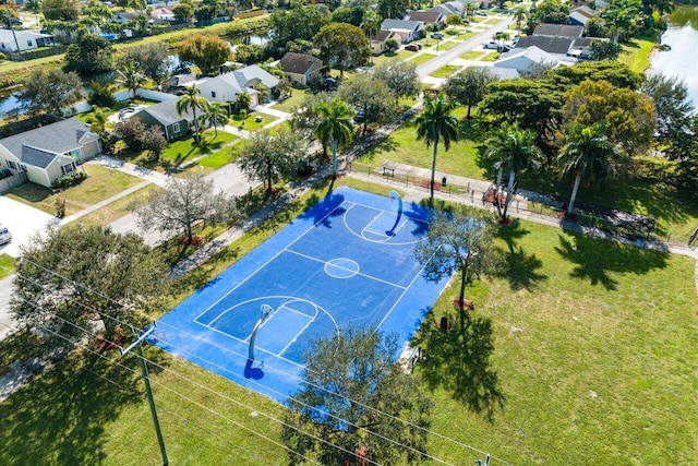 view of sport court with a water view