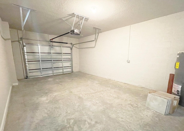 garage featuring water heater and a garage door opener