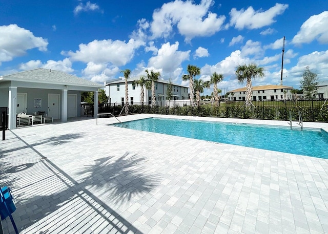 view of swimming pool featuring a patio