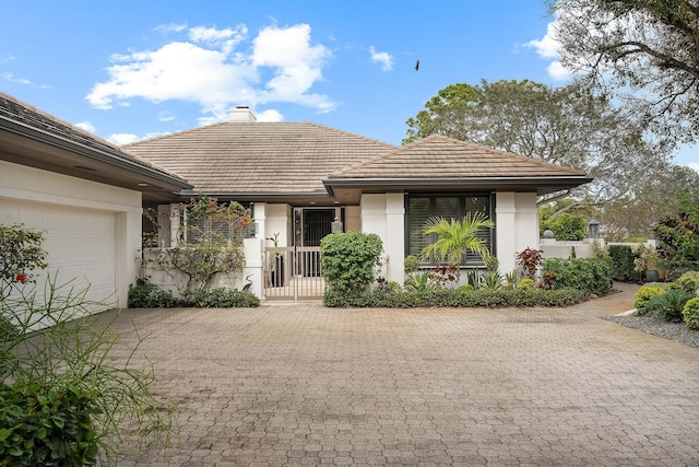 view of front of property with a garage