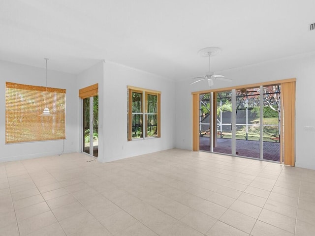 unfurnished room with ceiling fan and light tile patterned floors
