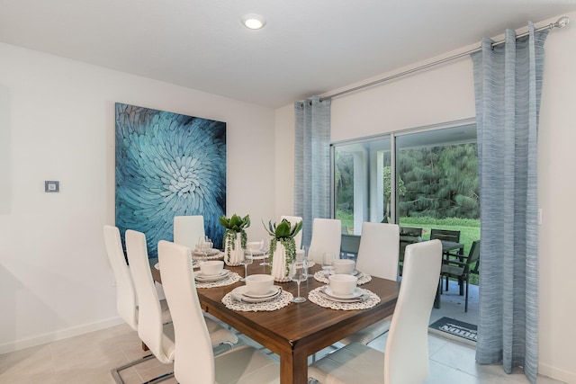 dining area featuring light tile patterned floors