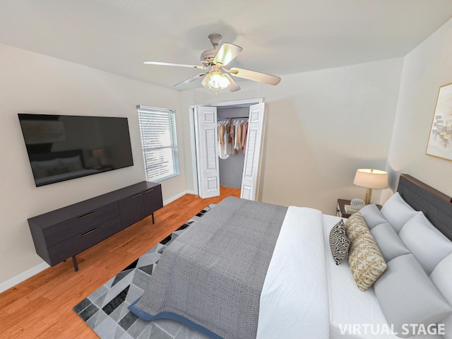 bedroom with wood-type flooring, a closet, and ceiling fan