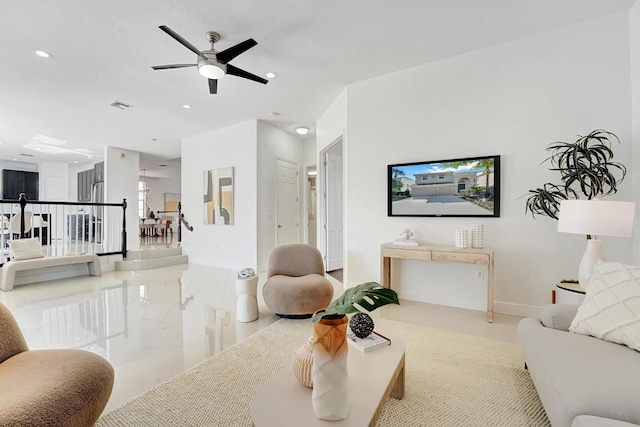 tiled living room with ceiling fan