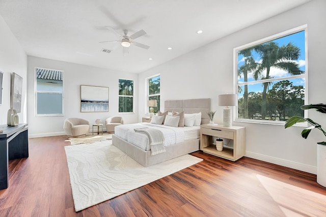 bedroom featuring wood-type flooring and ceiling fan