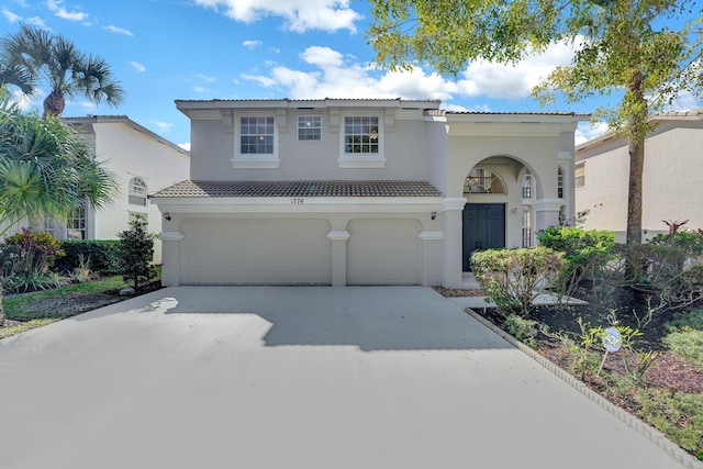 mediterranean / spanish house featuring a garage