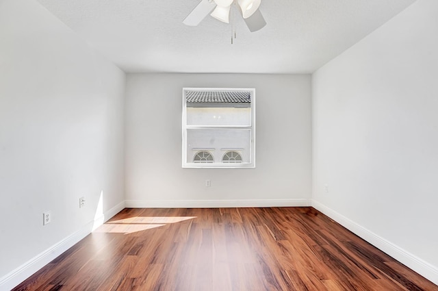 spare room featuring hardwood / wood-style floors, a textured ceiling, and ceiling fan