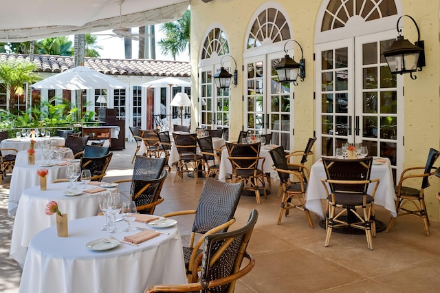 view of patio with ceiling fan and french doors