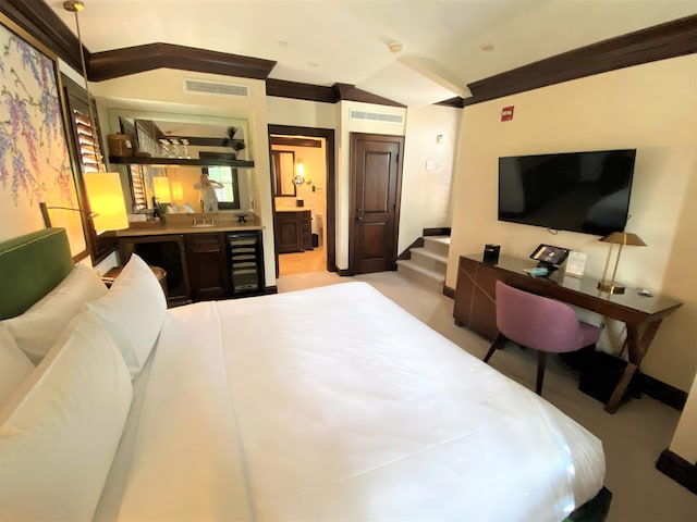 bedroom featuring ornamental molding, light carpet, and beverage cooler