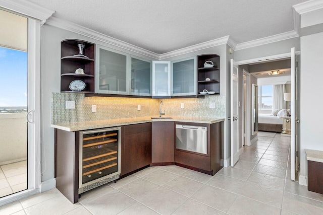 bar featuring wine cooler, dishwasher, plenty of natural light, and ornamental molding