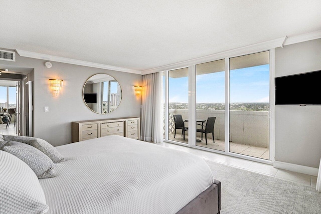 tiled bedroom featuring access to exterior, a textured ceiling, expansive windows, and crown molding