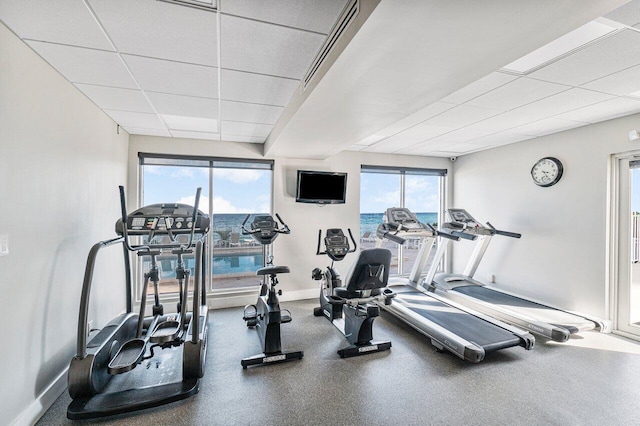 exercise room featuring a drop ceiling