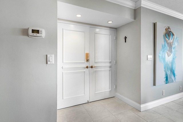 tiled foyer with crown molding