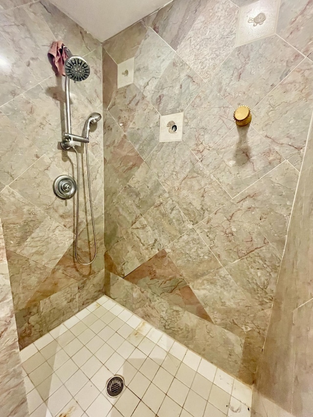 bathroom with tiled shower