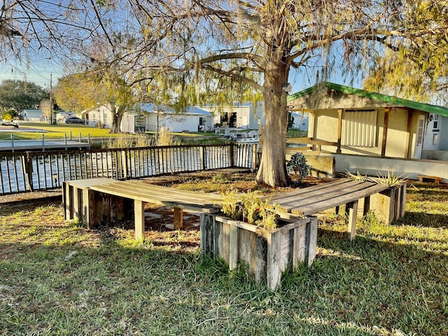 deck featuring a yard and a water view