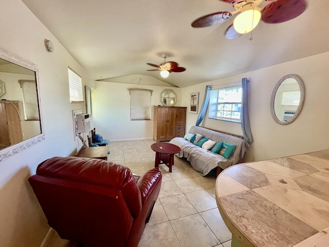 living room featuring ceiling fan, light tile patterned flooring, and lofted ceiling