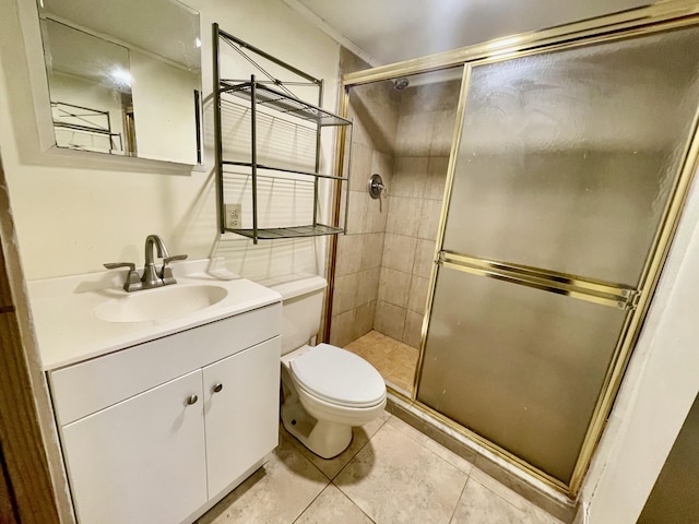 bathroom featuring toilet, vanity, tile patterned floors, and walk in shower