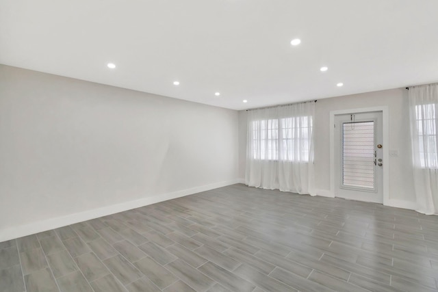 interior space featuring light wood finished floors, baseboards, and recessed lighting